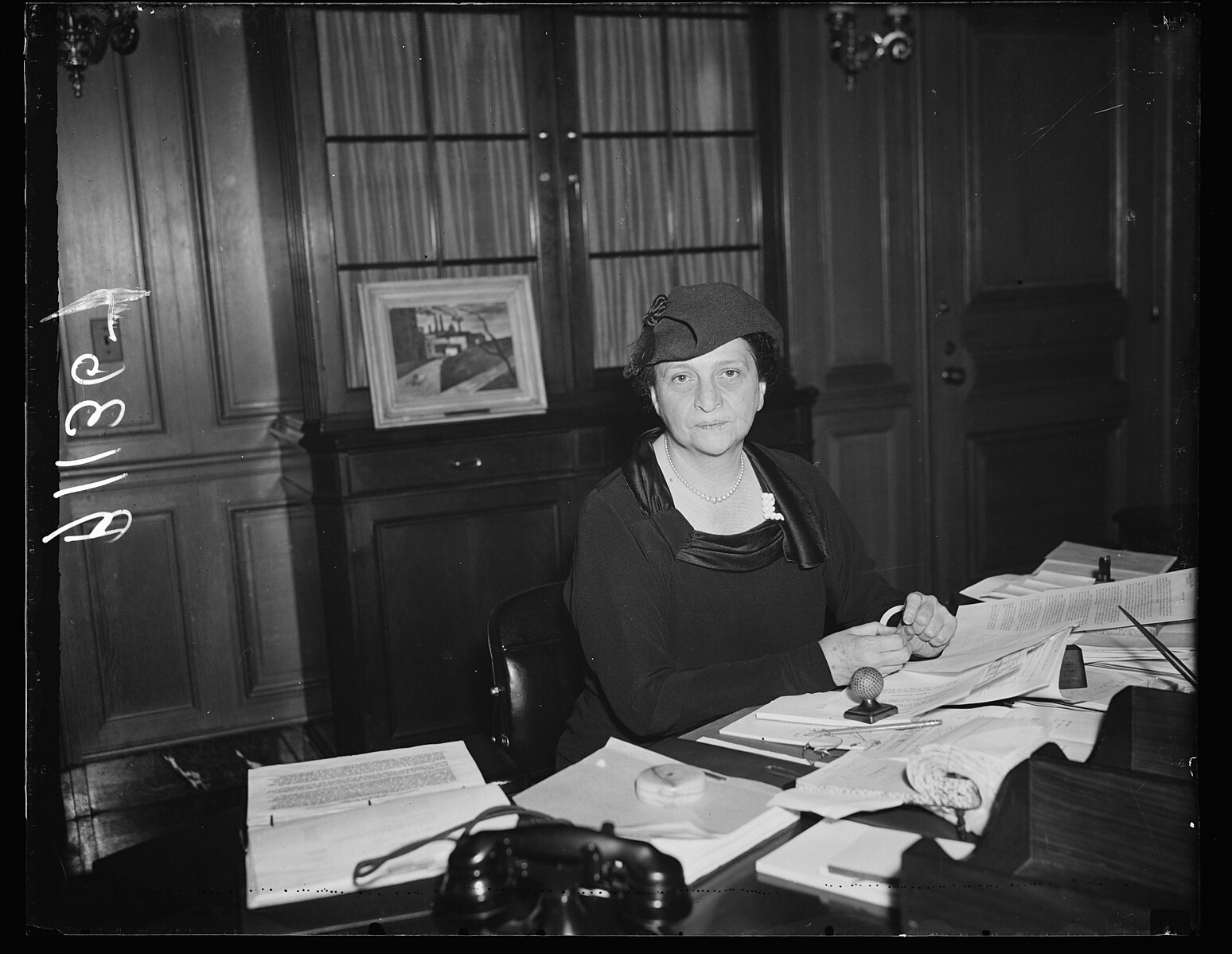 madame secretary. washington, d.c., oct. 6. a new and informal photograph of secretary of labor perkins, made at her desk in the labor department today lccn2016878623 (1)